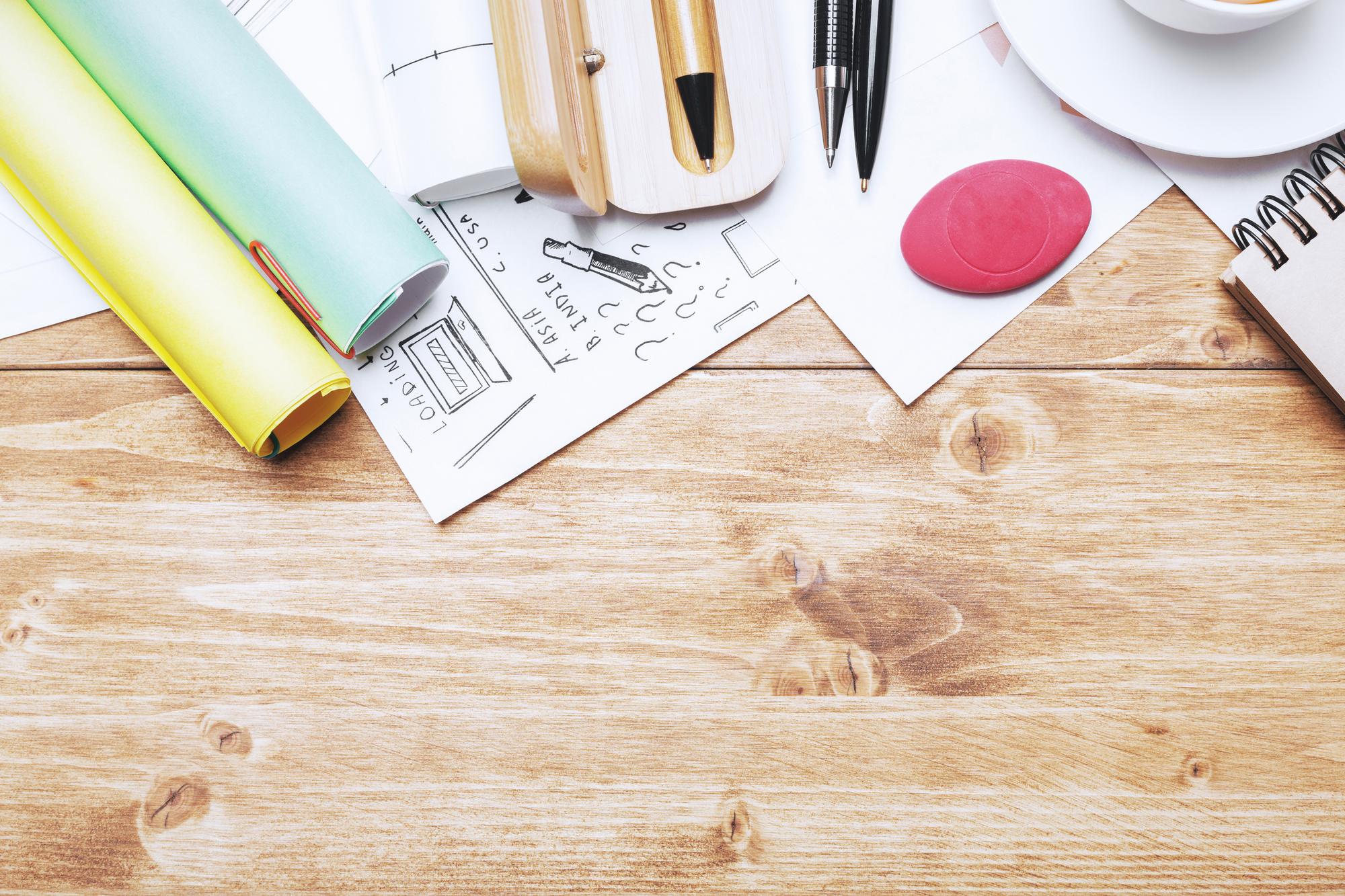Workshop table with tools and sketches